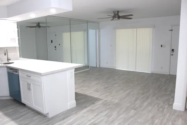 a kitchen with stainless steel appliances a refrigerator and a sink