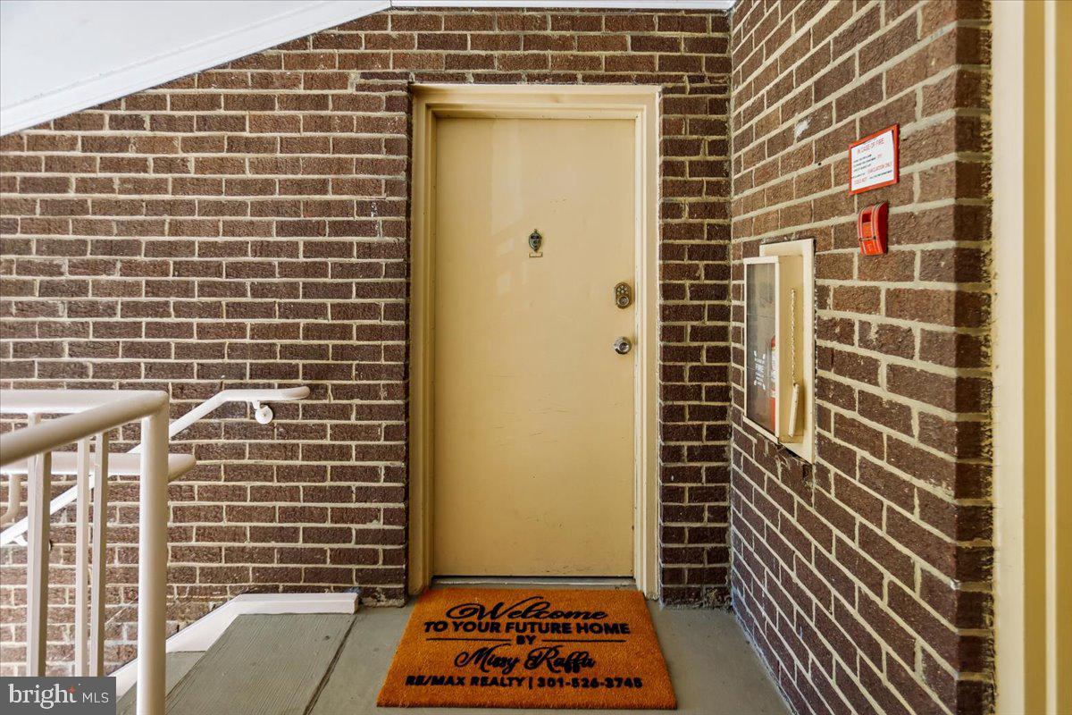17804 Buehler Road, Unit 3D3 Olney, MD 20832 - Photo 25 of 32 a view of a door with a wooden floor