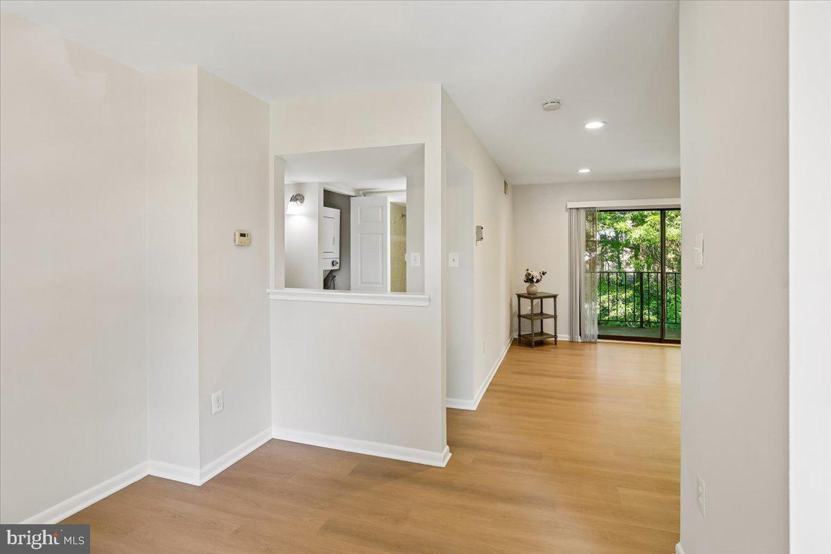 17804 Buehler Road, Unit 3D3 Olney, MD 20832 - Photo 8 of 32 an empty room with wooden floor and windows