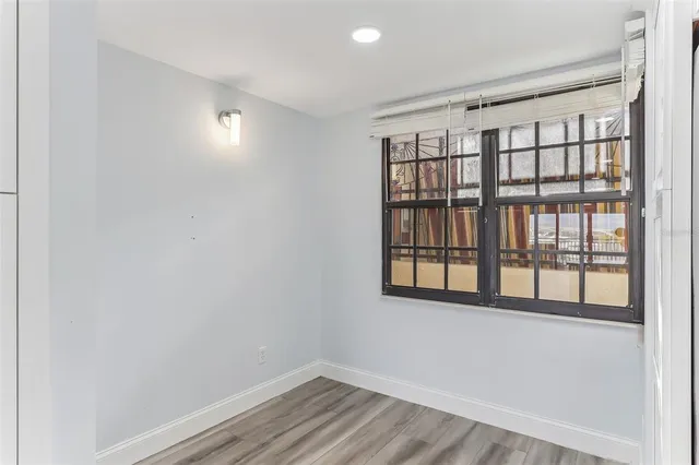 a bathroom with a granite countertop toilet and a sink