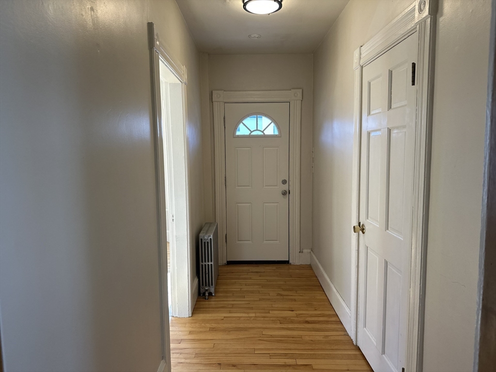 259 Albion Street, Unit 1 Wakefield, MA 01880 - Photo 12 of 14 a view of a hallway with wooden floor