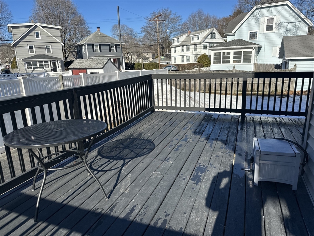 259 Albion Street, Unit 1 Wakefield, MA 01880 - Photo 14 of 14 a view of a balcony with wooden floor