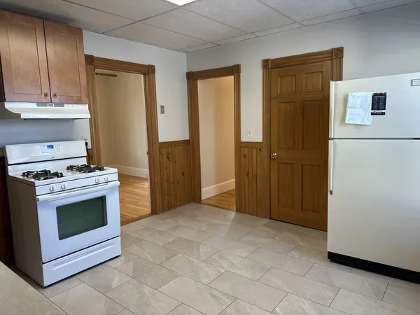 a kitchen with a stove and a refrigerator
