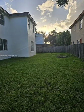 a front view of house with garden