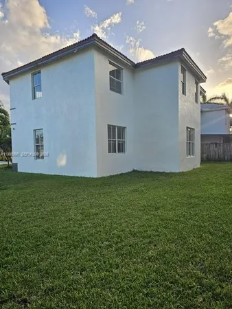 a house view with a garden space
