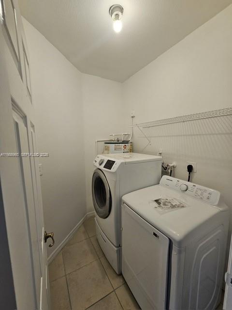 11151 Southwest 241st Street Homestead, FL 33032 - Photo 5 of 18 a utility room with dryer and washer
