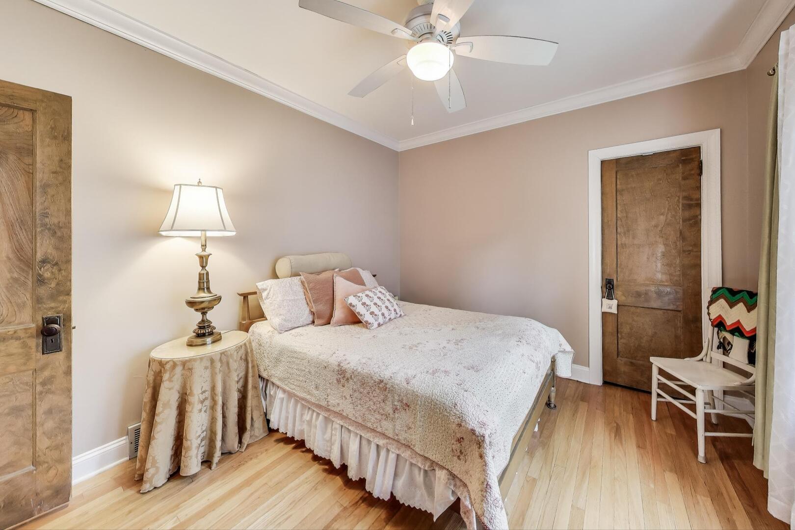 284 Addison Road Riverside, IL 60546 - Photo 18 of 44 a bedroom with a bed and wooden floor