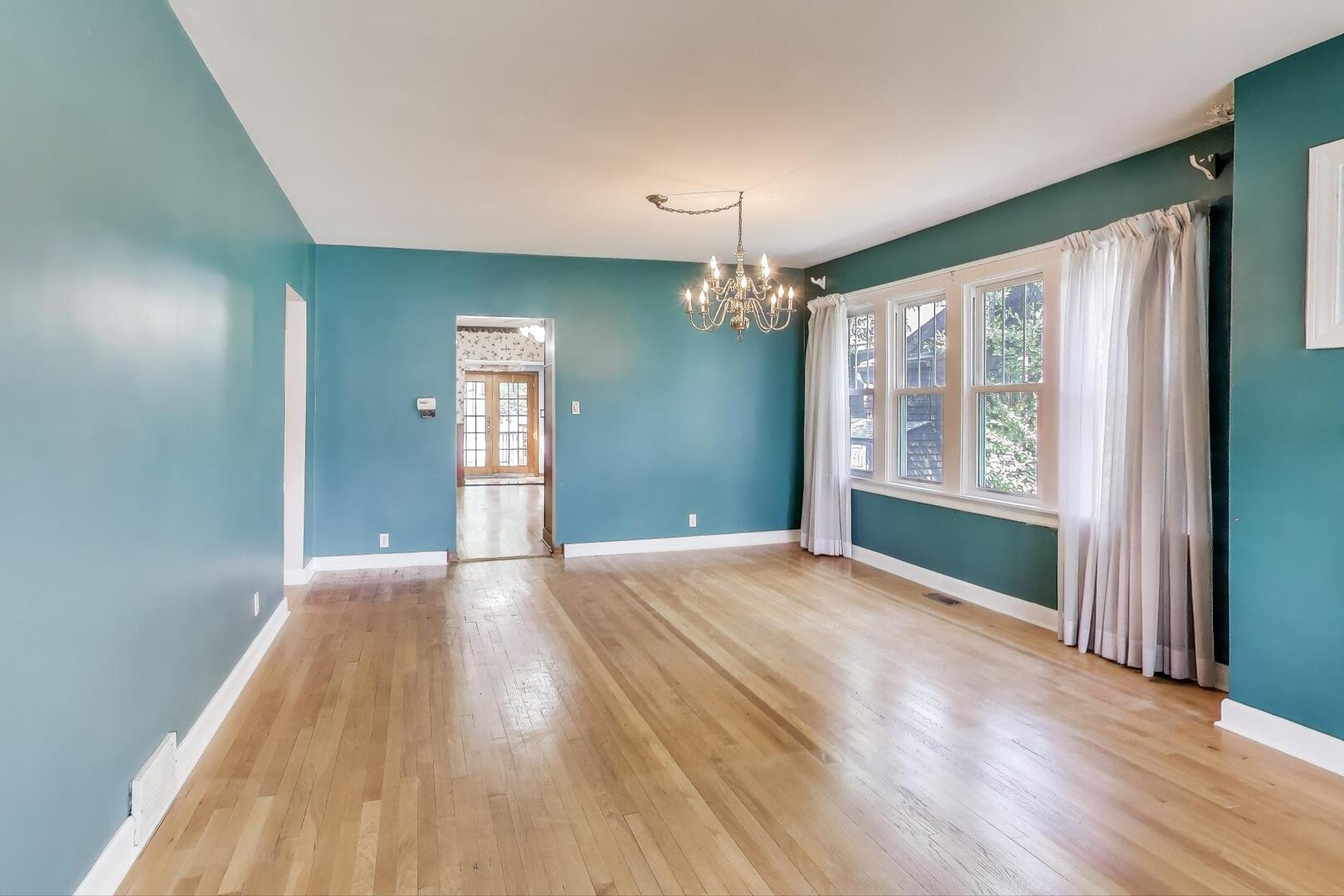 284 Addison Road Riverside, IL 60546 - Photo 9 of 44 a view of an empty room with window and wooden floor