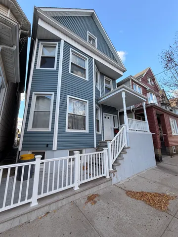 a front view of a house with a porch