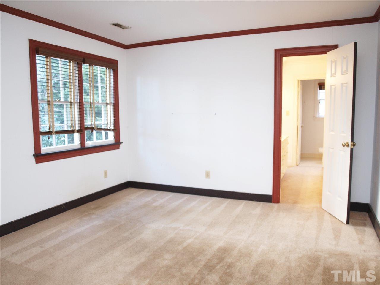 2326 Hales Road Raleigh, NC 27608 - Photo 14 of 21 an empty room with a window