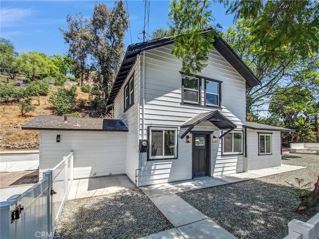a front view of a house with a garage