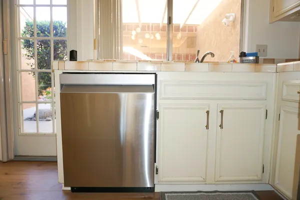 a view of cabinets and wooden floor