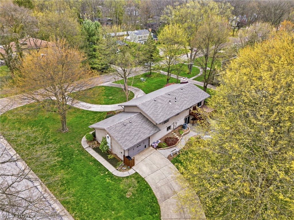 2400 Lancaster Road Akron, OH 44313 - Photo 35 of 41 Aerial view of the property showcasing a curved driveway, a well-maintained lawn, and mature trees