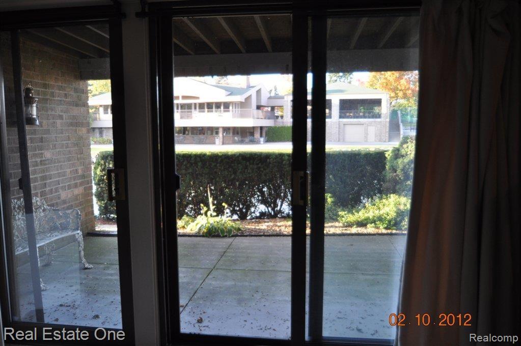 960 Brookwood Lane East, Unit 2 Rochester, MI 48309 - Photo 11 of 15 Fin'd LL with doorwall to patio