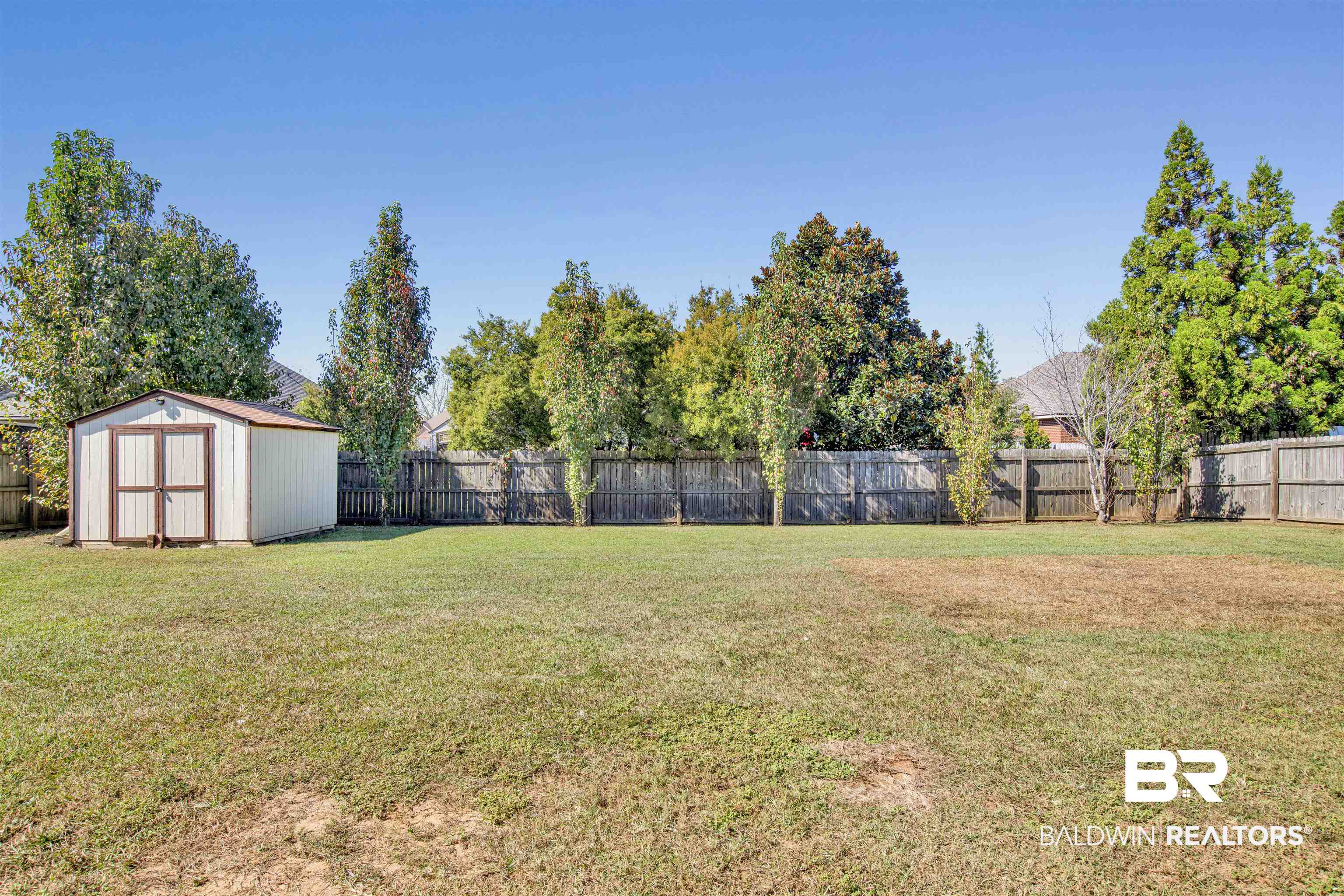 24159 Tullamore Drive Daphne, AL 36526 - Photo 28 of 31 View of yard featuring a storage unit