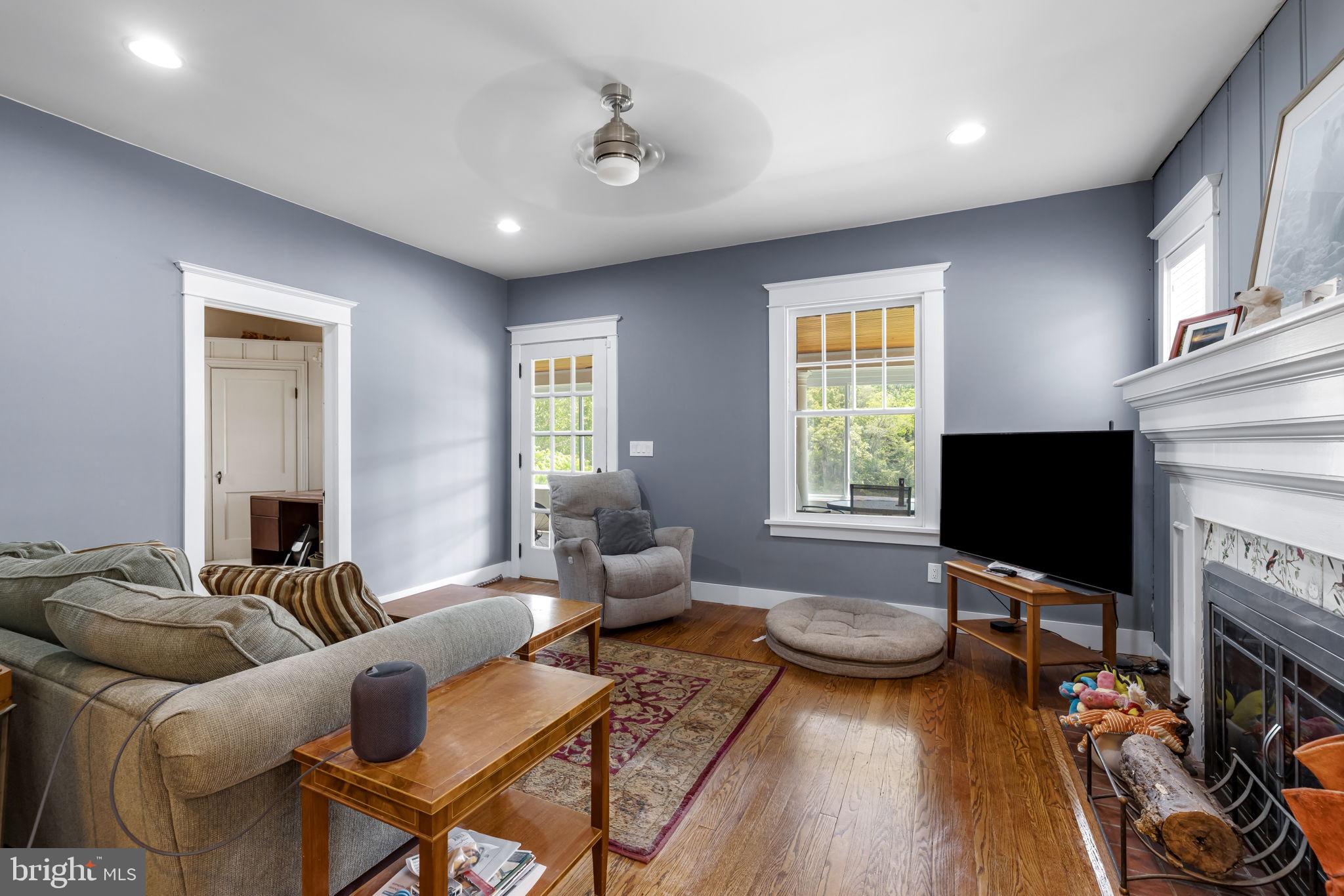 765 Dividing Road Severna Park, MD 21146 - Photo 4 of 17 a living room with furniture and a flat screen tv