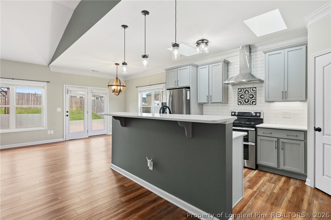 33 Colonist Place Cameron, NC 28326 - Photo 15 of 47 a kitchen with stainless steel appliances granite countertop a stove and a refrigerator