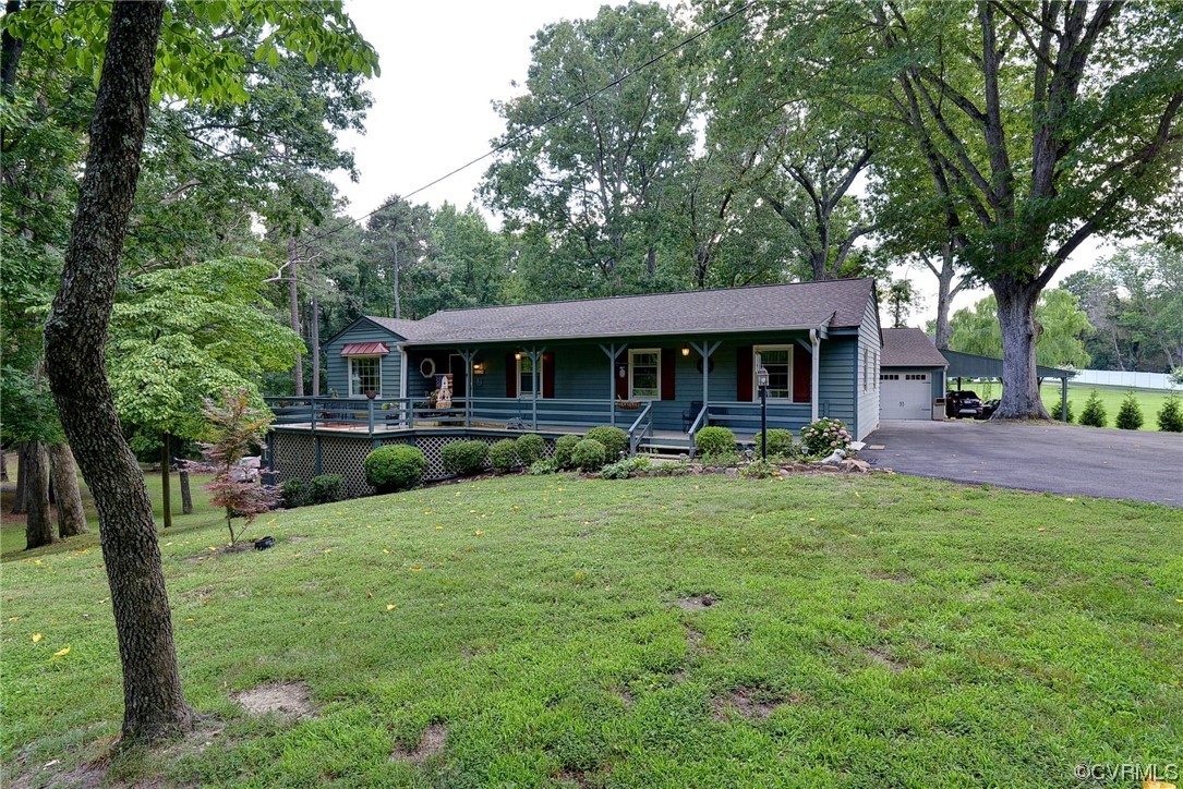 7317 Creighton Road Mechanicsville, VA 23111 - Photo 1 of 46 a front view of a house with yard patio and green space