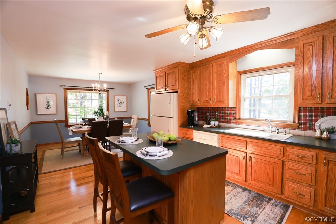 7317 Creighton Road Mechanicsville, VA 23111 - Photo 13 of 46 a kitchen with a dining table and chairs