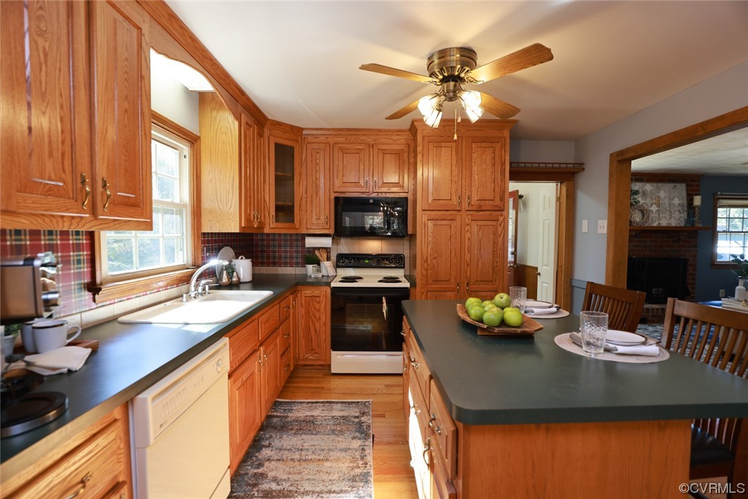 7317 Creighton Road Mechanicsville, VA 23111 - Photo 15 of 46 a kitchen with a sink stove top oven and cabinets
