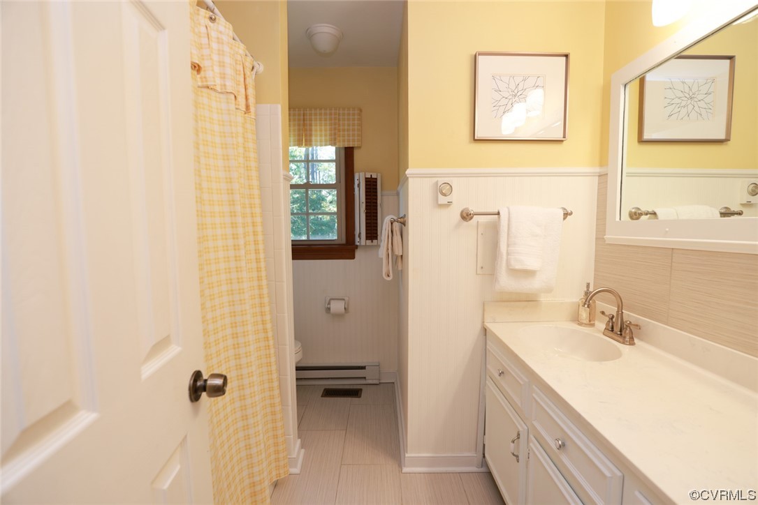 7317 Creighton Road Mechanicsville, VA 23111 - Photo 26 of 46 a bathroom with a sink and a mirror