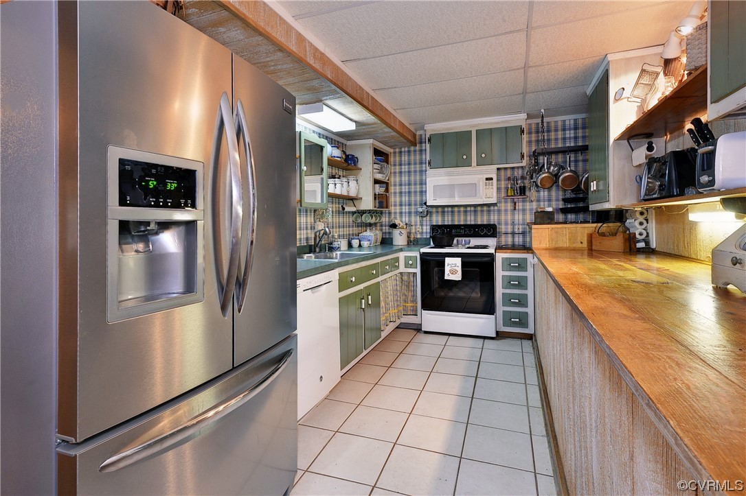 7317 Creighton Road Mechanicsville, VA 23111 - Photo 29 of 46 a large kitchen with stainless steel appliances granite countertop a refrigerator and a stove top oven