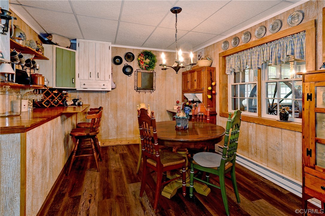 7317 Creighton Road Mechanicsville, VA 23111 - Photo 30 of 46 a view of a dining room with furniture window and wooden floor