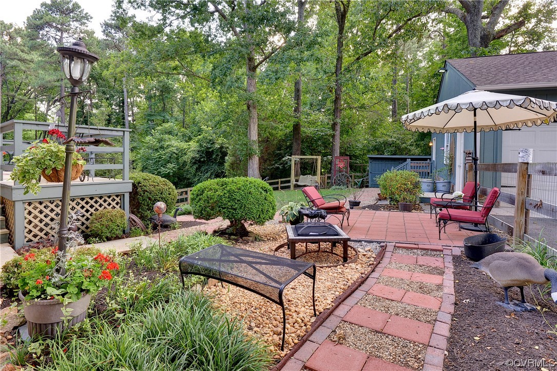 7317 Creighton Road Mechanicsville, VA 23111 - Photo 39 of 46 a view of a backyard with furniture and a garden