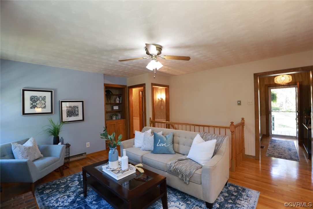 7317 Creighton Road Mechanicsville, VA 23111 - Photo 9 of 46 a living room with furniture and wooden floor