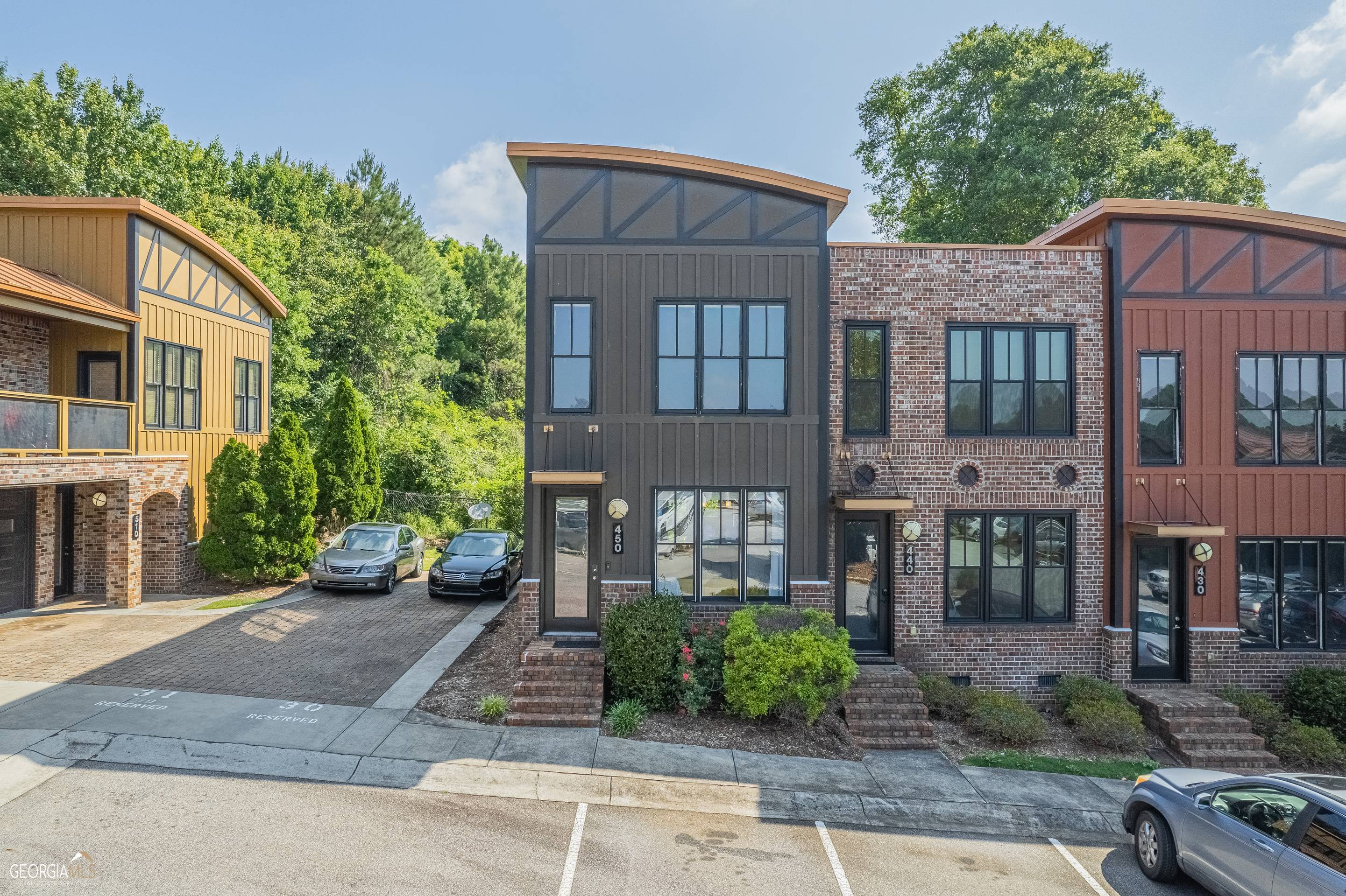 118 Ruth Drive, Unit 450 Athens, GA 30601 - Photo 1 of 1 a front view of a residential apartment building with a yard