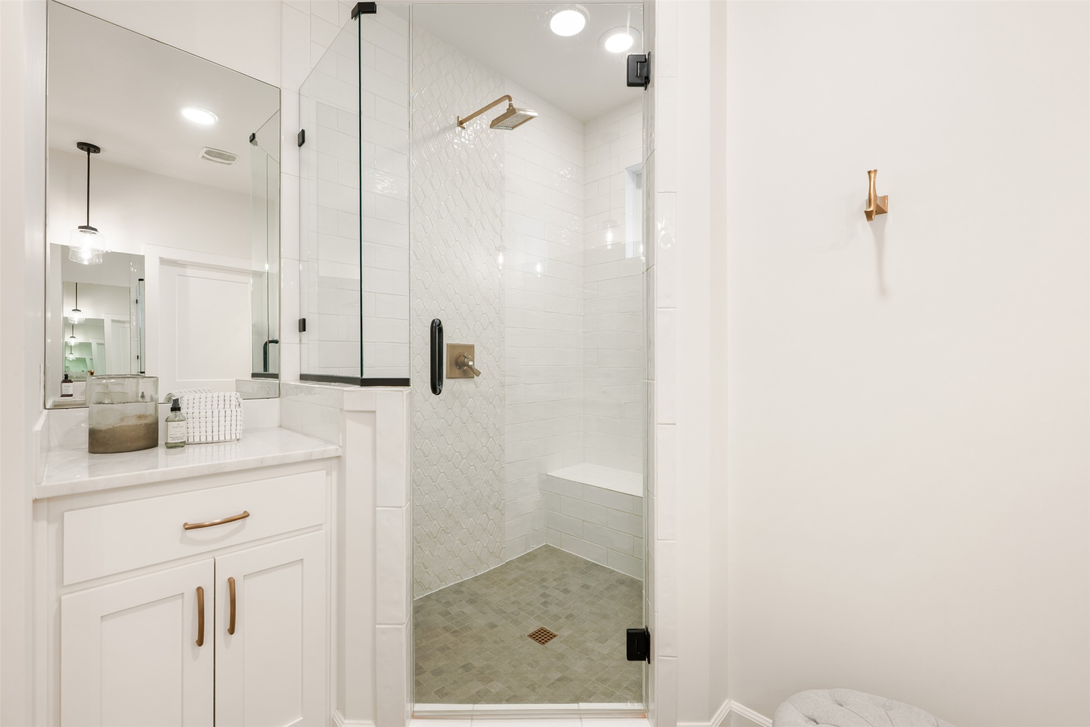 1301 West Street Georgetown, TX 78626 - Photo 23 of 40 A refined bathroom features a spacious shower with tile flooring and a sleek vanity with a large mirror.