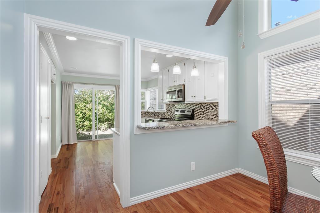 4139 Rosser Square Dallas, TX 75244 - Photo 12 of 34 Seamlessly connected dining space featuring a convenient pass-through to the kitchen—ideal for entertaining.