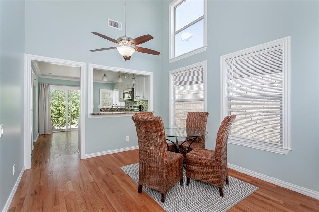 4139 Rosser Square Dallas, TX 75244 - Photo 2 of 34 Seamlessly connected dining space featuring a convenient pass-through to the kitchen perfect for entertaining.