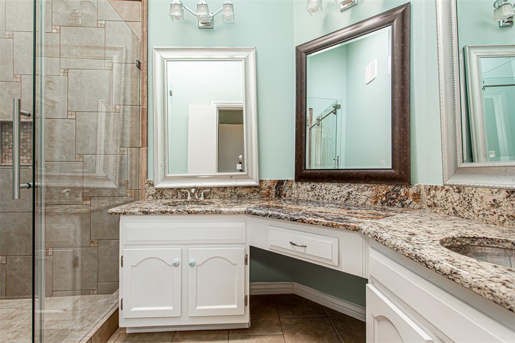 4139 Rosser Square Dallas, TX 75244 - Photo 25 of 34 Ensuite featuring dual sinks, granite countertops, and ample storage.