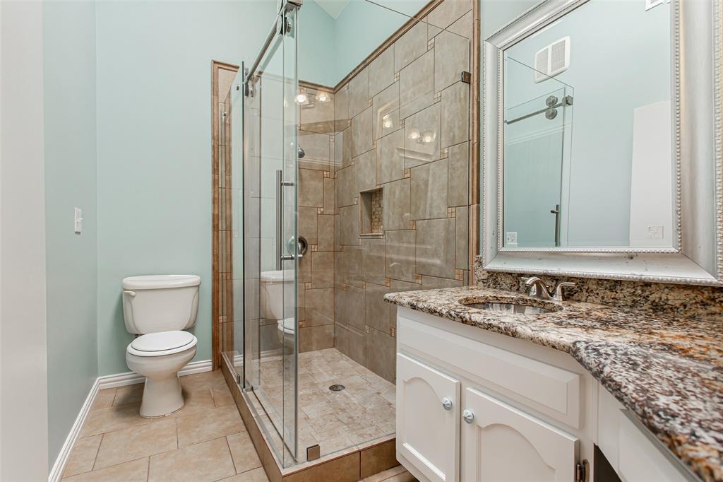 4139 Rosser Square Dallas, TX 75244 - Photo 26 of 34 Luxurious primary bath offering an oversized glass shower with tile surround.