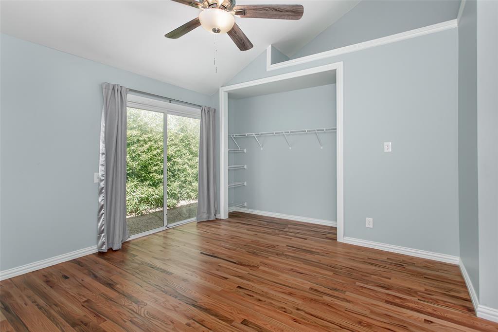 4139 Rosser Square Dallas, TX 75244 - Photo 28 of 34 Sunlit bedroom with timeless hardwood flooring, neutral tones, and elegant trim details throughout.