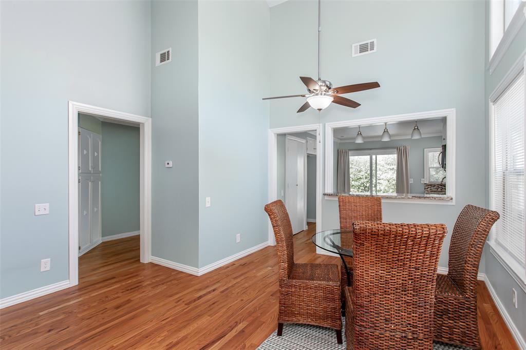 4139 Rosser Square Dallas, TX 75244 - Photo 10 of 34 Stunning open-concept layout combining the living and dining areas, enhanced by soaring ceilings, modern ceiling fans, and abundant natural light.