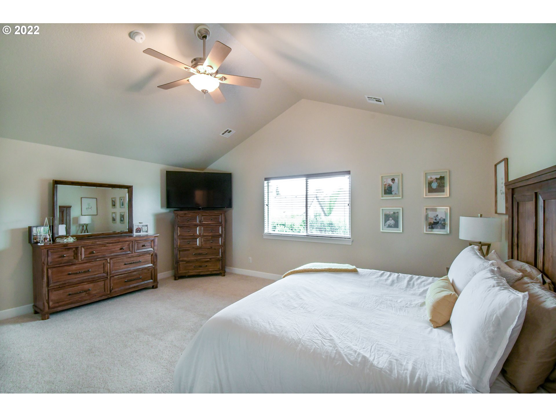901 T Street Springfield, OR 97477 - Photo 12 of 29 a bedroom with a large bed and a tv