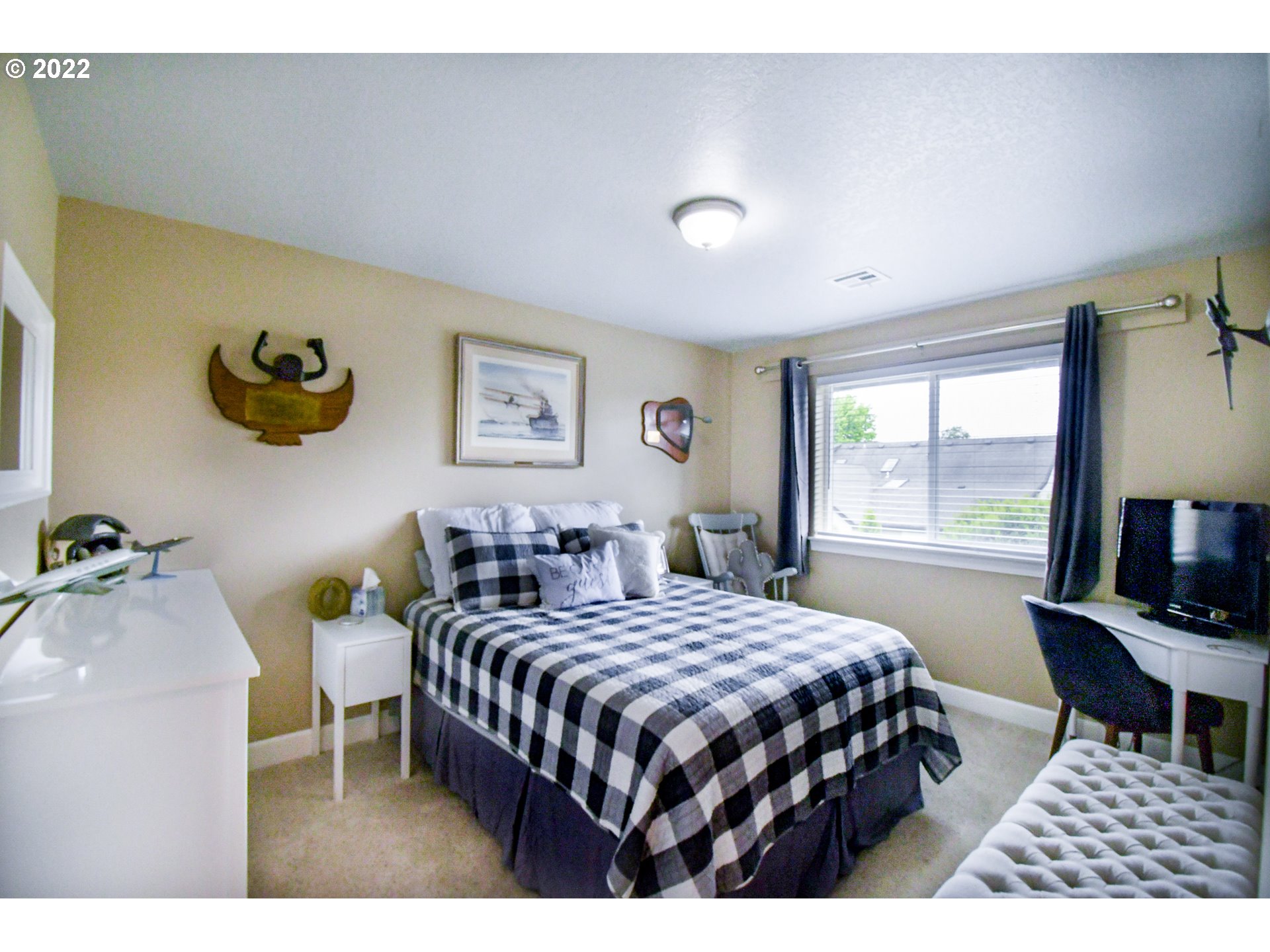 901 T Street Springfield, OR 97477 - Photo 17 of 29 a bedroom with a bed and a table with rug