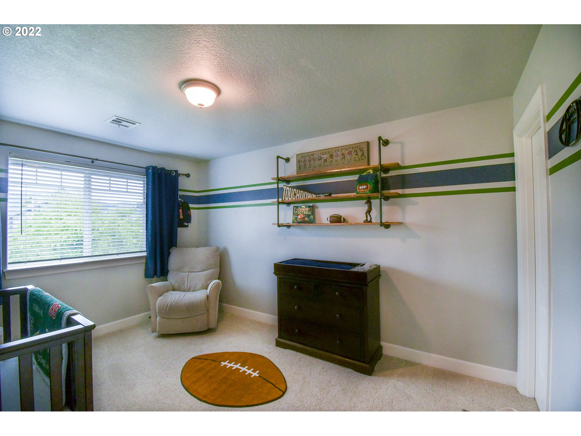 901 T Street Springfield, OR 97477 - Photo 18 of 29 a living room with furniture a flat screen tv and a fireplace
