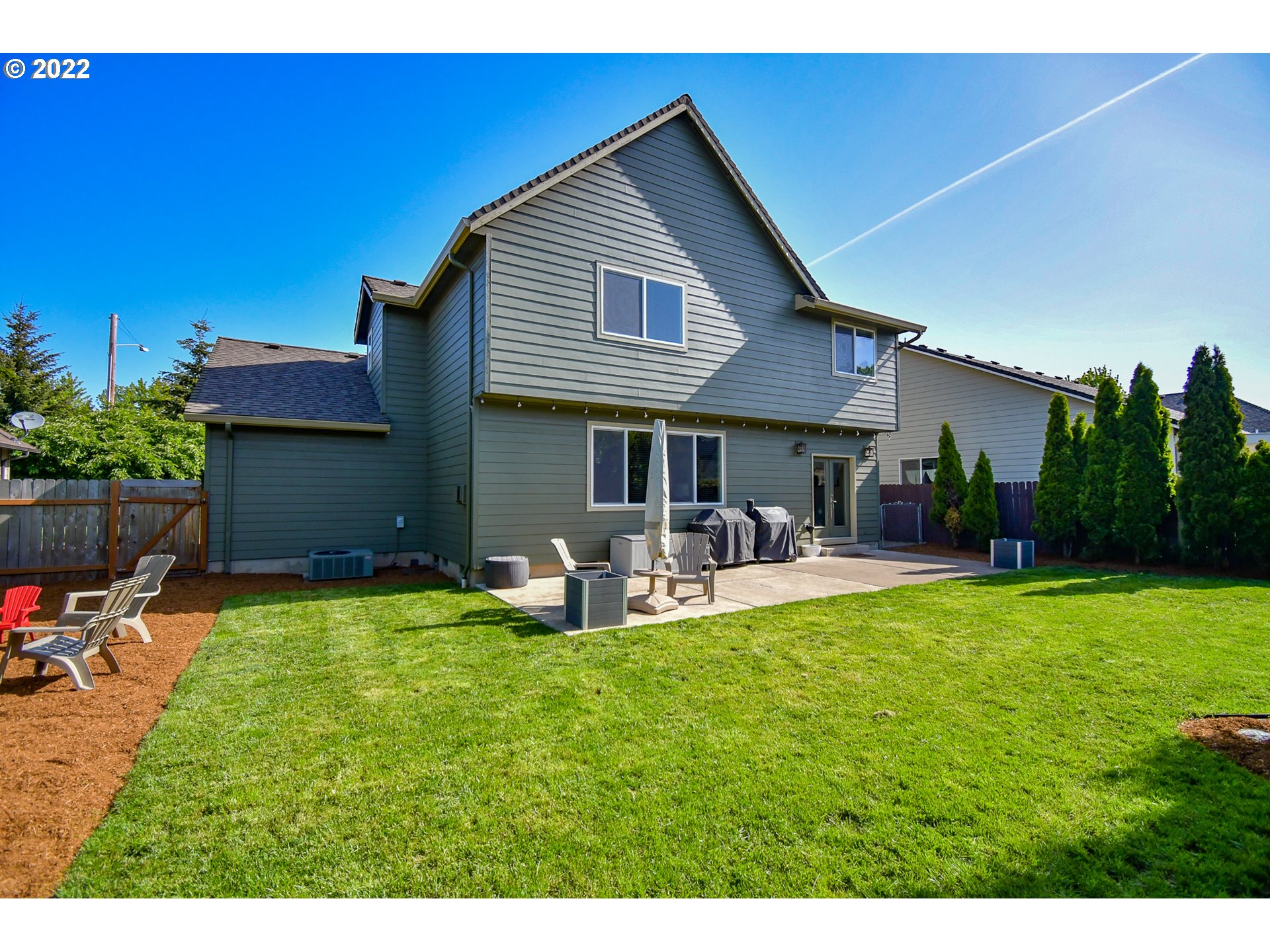 901 T Street Springfield, OR 97477 - Photo 20 of 29 a front view of house with yard and seating area