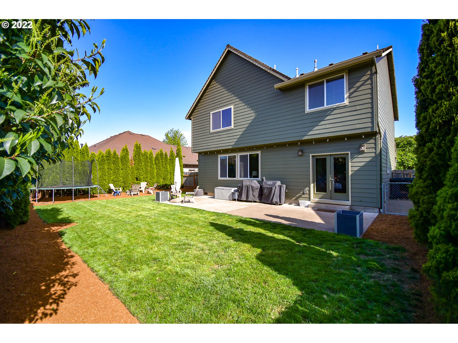 901 T Street Springfield, OR 97477 - Photo 22 of 29 a view of a house with a yard patio and swimming pool