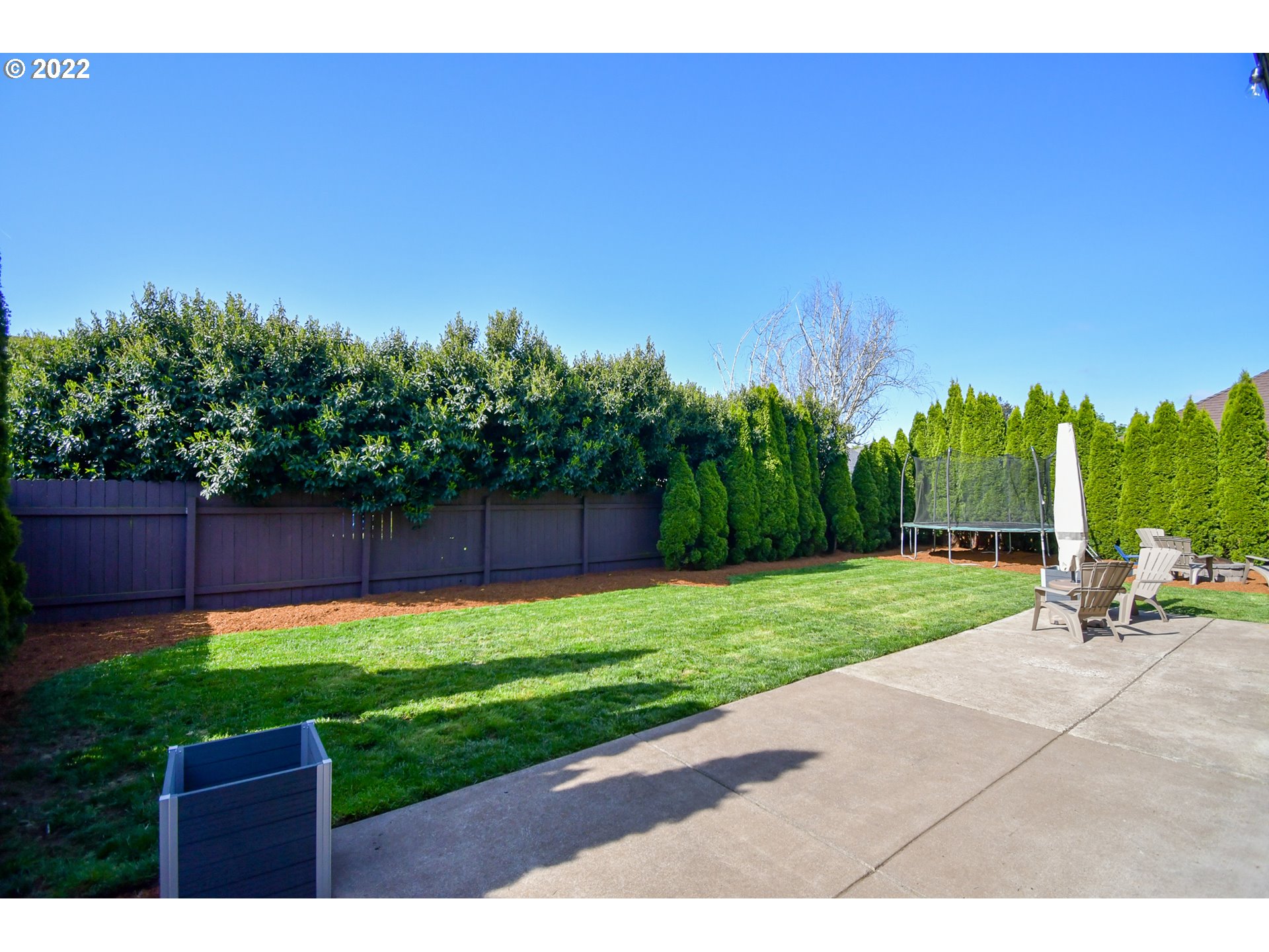 901 T Street Springfield, OR 97477 - Photo 24 of 29 a view of a park with a bench and wooden fence