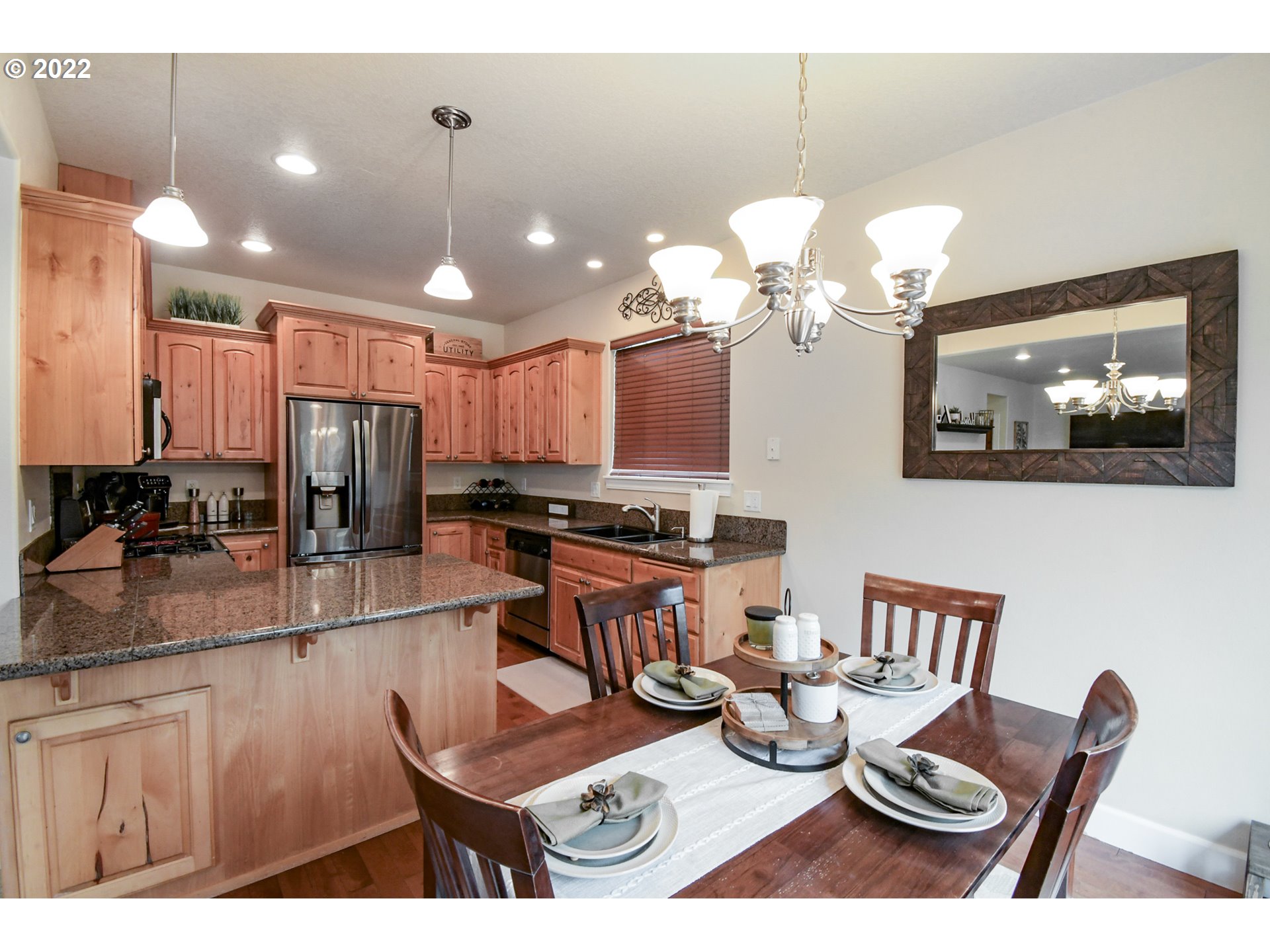 901 T Street Springfield, OR 97477 - Photo 6 of 29 a kitchen with stainless steel appliances granite countertop a stove a kitchen island a dining table and chairs