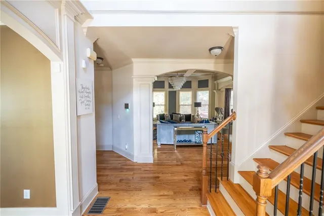 a living room with fireplace furniture and a flat screen tv