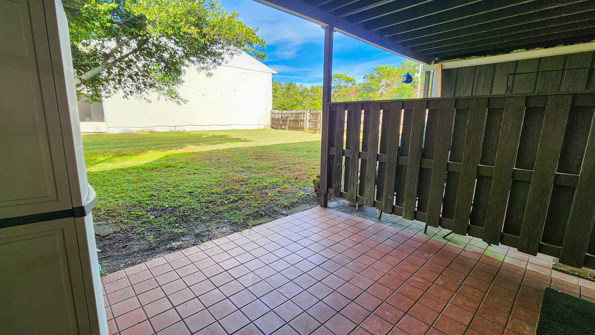 145 4th Avenue, Unit B3 Shalimar, FL 32579 - Photo 17 of 28 a view of a backyard with wooden fence