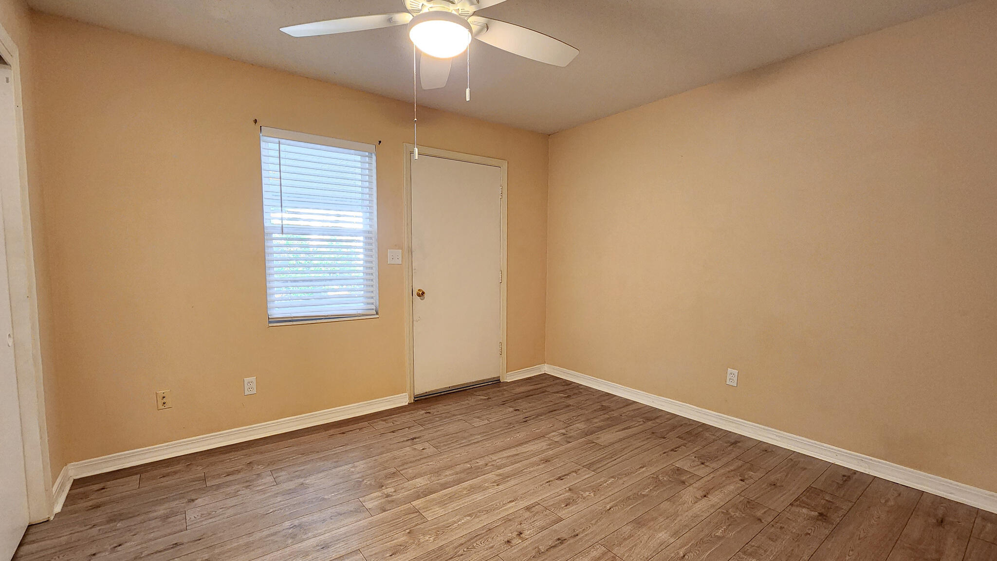 145 4th Avenue, Unit B3 Shalimar, FL 32579 - Photo 19 of 28 an empty room with wooden floor and windows