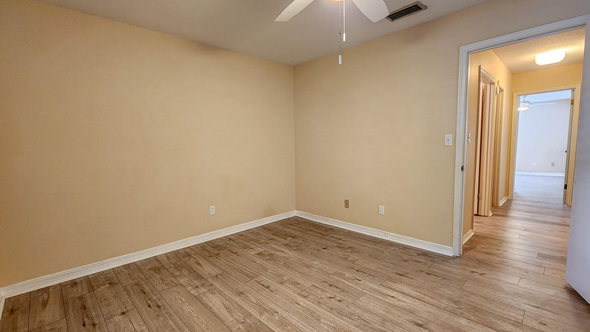 145 4th Avenue, Unit B3 Shalimar, FL 32579 - Photo 20 of 28 a view of a room with wooden floor