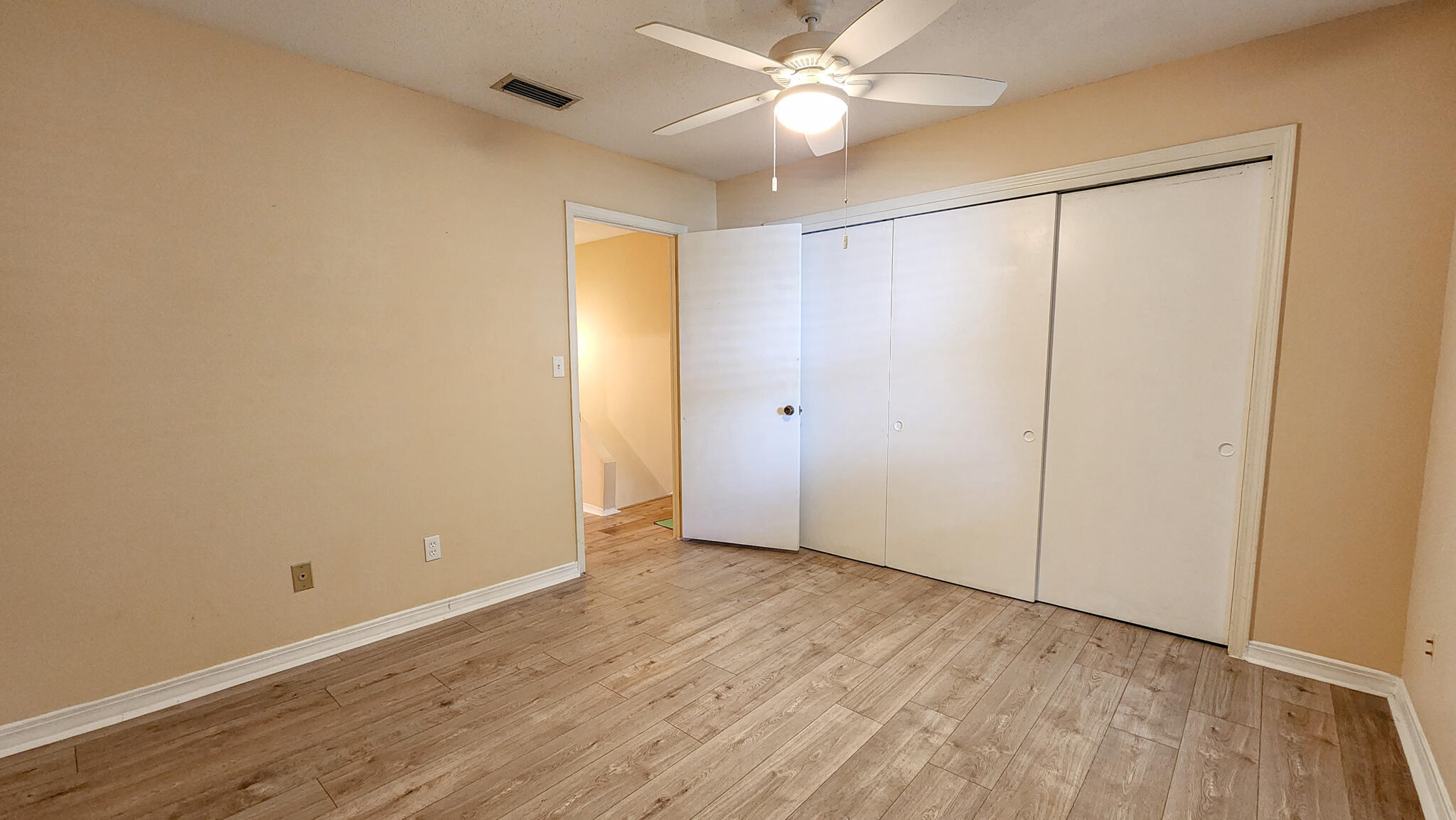 145 4th Avenue, Unit B3 Shalimar, FL 32579 - Photo 21 of 28 a view of an empty room with wooden floor