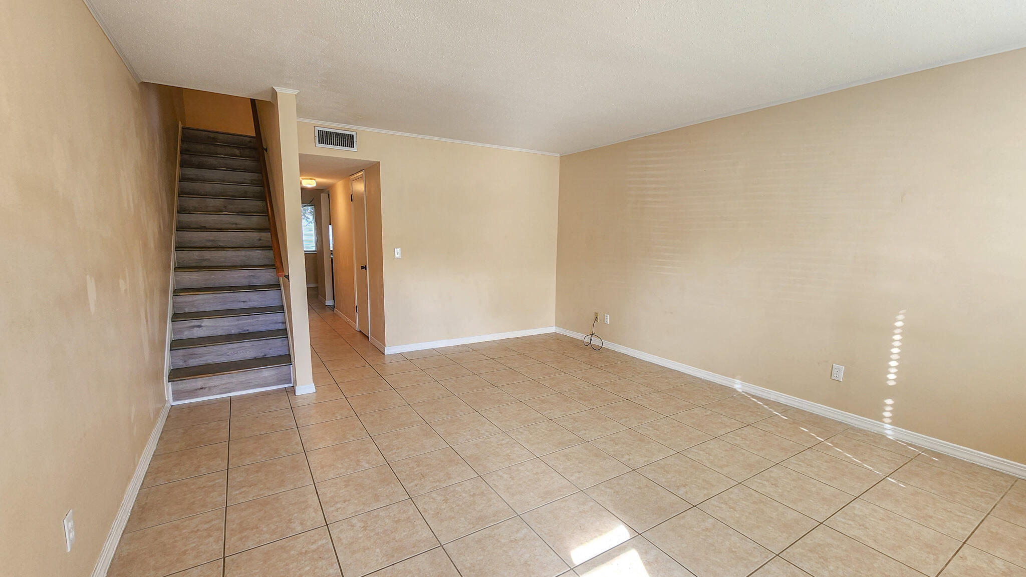 145 4th Avenue, Unit B3 Shalimar, FL 32579 - Photo 3 of 28 a view of an empty room with stairs